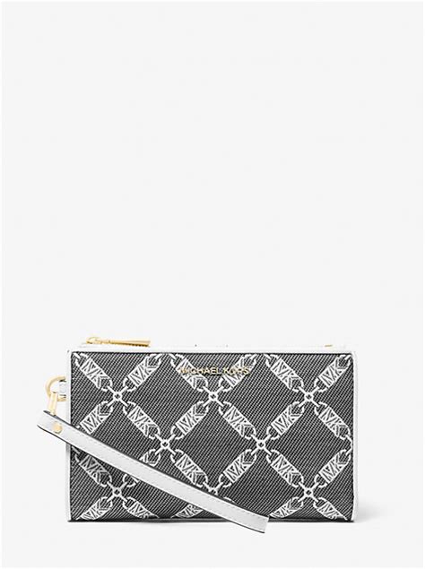 michael kors jet set monogram small wristlet|Jet Set Striped Empire Monogram Wristlet .